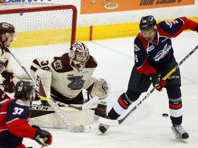 Peterborough Petes' goalie Dylan Wells makes a save against Windsor Spitfires' Cole Purboo during third period OHL action on Nov. 24, 2016 at the Memorial Centre in Peterborough. The Petes lost 5-4 in overtime.