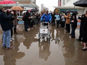 Joe Roberts makes a stop at Charles Clark Square in Windsor on Wednesday, November 23, 2016. Roberts is pushing a shopping cart across Canada in support of youth homelessness.