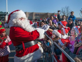 Santa Claus is greeted by his fans after touching down in the parking lot of Devonshire Mall in Windsor in this November 2015 file photo.