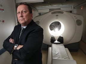 Dr. Kevin Tracey is shown with a PET scanner on June 22, 2016, at his Howard Avenue office in Windsor.