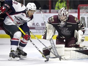 Windsor's Jeremiah Addison takes a shot on Peterborough goalie Dylan Wells during OHL action between the Windsor Spitfires and the Peterborough Petes at the WFCU Centre on Nov. 13, 2016.