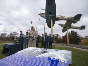 Signs honouring military aircraft are unveiled at Jackson Park, Sunday, Nov. 20, 2016.