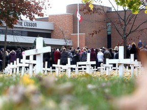 L'Essor high school students take part in a Remembrance Day ceremony on Nov. 11, 2016 to honour Second World War Hector Roberge, who passed away last year.