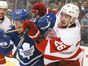 Toronto Maple Leafs R.A. Parenteau and Tomas Jurco of the Detroit Red Wings (26) collide in an NHL preseason game on Oct. 3, 2015 at the Air Canada Centre in Toronto.