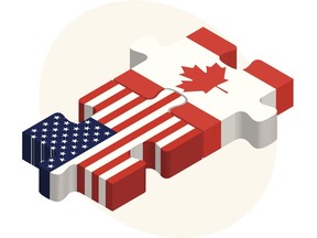 USA and Canada flags in puzzle. Image by Getty Images.