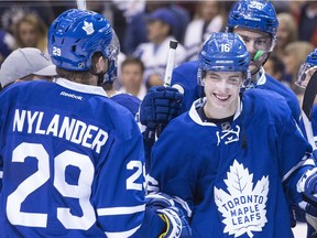 Toronto Maple Leafs' William Nylander, left, congratulates Mitch Marner after their team's 4-1 win over the Boston Bruins following NHL hockey action, in Toronto on Oct. 15, 2016.