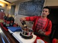 Steve Mitchell serves up some mulled wine at Sprucewood Shores Estate Winery in Amherstburg on Wednesday, November 16, 2016.