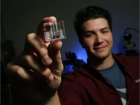 Austin Liolli holds up a 3-D lab on a chip at the University of Windsor on Nov. 2, 2016. Liolli worked on the project and will travel to Phoenix to present his work at the Young Engineer Paper contest.