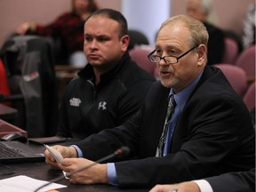Luis Mendez, left, and Larry Horwitz address city council on the Pelissier Street parking garage issue at city hall in Windsor on Nov. 28, 2016.