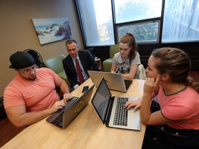 University of Windsor Dean of Sciences Chris Houser (second from left) goes over drowning data with students Brent Vlodarchyk, Summer Locknick and Alexandra Scaman (left to right) in Windsor on Monday, November 7, 2016. Houser studies riptides and will travel to Costa Rica with a team of students this spring.