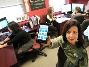 Marian Drouillard. manager of geomatics, centre, is shown with her GIS staff: Allison Charko, left, Jovana Burz, Larisa Johnstone and Joe Cartier (not shown) at Windsor City Hall on Nov. 16, 2016.