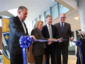 Dave Cooke, left, Janet Graybiel, University of Windsor president Alan Wildeman and Windsor Mayor Drew Dilkens are shown during the opening of the new University of Windsor School of Social Work and Centre for Executive and Professional Education in downtown Windsor  on Nov. 21, 2016. The location is the former Windsor Star building located at Pitt Street and Ferry Street.