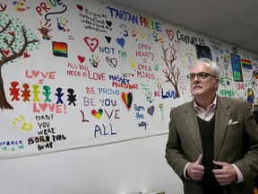 Bob Williams, executive director of the Windsor Pride Community Education and Resource Centre at 422 Pelissier St., stands in front of a mural created by high school students, on Nov. 29, 2016.