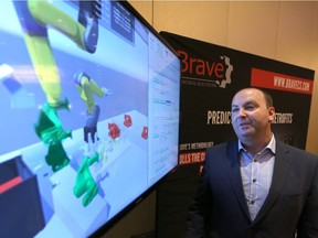 Brent McPhail. president at Brave Control Solutions Inc., demonstrates video game software that his company has developed to build a twin of actual equipment in industry.  McPhail and dozens of there companies took part in the WindsorEssex Economic Development How the Innovation and the Internet is Changing the World and How That Could Impact the Region event at Caesars Windsor.