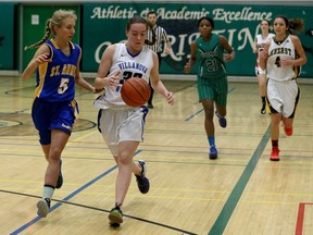 St. Anne's Madi Bardoel, left, runs with Villanova Wildcats Kristen Swiatoshik as Herman's Jada Jackson and Amherst's Grace Clifford, right, trail the play in WECSSAA Tier 1 senior girls basketball all-star game at W.F. Herman Academy gymnasium on Nov. 30, 2016.