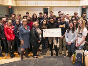 University of Windsor Odette School of Business students present a donation cheque to the Downtown Mission on November 8, 2016.