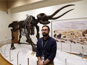 Craig Capachhione, museum co-ordinator, education for the City of Windsor, stands in the Ice Age Mammals exhibit at the Chimczuk Museum in Windsor on Oct. 20, 2016.