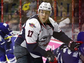 Windsor Spitfires Logan Stanley battles Mississauga Steelheads Marcus Dickerson, right, in OHL action from WFCU Centre on Oct. 6, 2016.