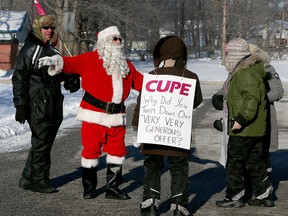 Northridge Santa was giving out hugs on the picket line for Essex County Library librarians and drivers on picket line on Fairview Avenue Dec. 19, 2016.