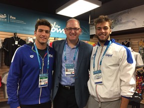 Italian swimmers Gabriele Detti (left) and Gregorio Paltrinieri flank Windsor Mayor Drew Dilkens at the WFCU Centre in Windsor on Dec. 7, 2016.