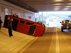 An overturned truck on the Herb Gray Parkway on Dec. 8, 2016. Slippery conditions saw police responding to numerous collisions.