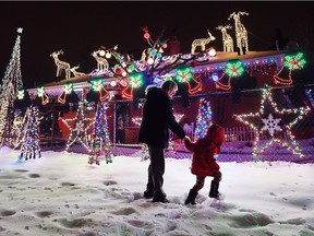 Cindy Ferron and her grandson Neino Ferron, 3, check out an amazing Christmas lighting display at a home at 1290 Matthew Brady Blvd. Dec. 21, 2016.