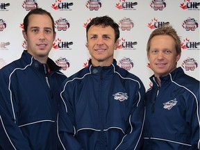 The 2016 Windsor Spitfires are led by head coach Rocky Thompson, centre, and assistants Jerrod Smith, left, and Trevor Letowski.