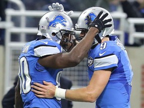 Quarterback Matthew Stafford #9 of the Detroit Lions celebrates a first half touchdown with Anquan Boldin #80 against the Chicago Bears at Ford Field on Dec. 11, 2016.