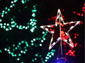 Christmas decorations wrap around the trees in Poplar Crescent Park in Fort McMurray, Alta., on Dec. 12, 2015