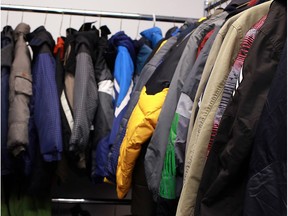 Coats hang on racks at the Unemployed Help Centre, on Nov. 3, 2012.
