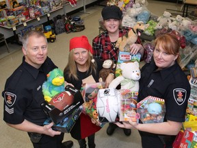 Back in December 2012, Windsor Police Service made a sizable donation of toys to the Windsor-Essex Children's Aid Society. Here Sgt. Andrew Moxley, left, Tina Gatt and Andrea Madden of the CAS and Const. Holly Burt pose with some of the toys.