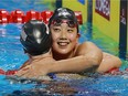 Leah Smith, left, of the USA gets a congratulatory hug from Chihiro Agarashi of Japan after the 400-metre freestyle final at the 2016 FINA World Swimming Championships on  Dec. 9, 2016, at the WFCU Centre.