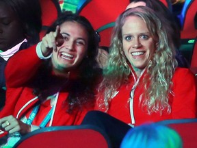 LaSalle's Kylie Masse, left, and Canadian teammate Hilary Caldwell are shown during the opening ceremony for the FINA World Swimming Championships held at Caesars Windsor on Dec. 5, 2016.