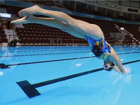 Former Olympic swimmer Kelly Stefanshyn makes the first ceremonial splash on Dec. 2, 2016, at the FINA World Swimming Championships pool at the WFCU Centre in Windsor.