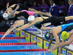 Female 400 metre freestyle relay members start their race during the 2016 FINA World Swimming Championships on Dec. 6, 2016, at the WFCU Centre in Windsor.
