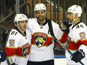 Jonathan Marchessault (81), Aaron Ekblad (5) and Jakub Kindl (46) of the Florida Panthers celebrate Ekblad's third-period goal against the New York Rangers at Madison Square Garden on Nov. 20, 2016 in New York City.