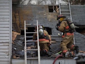 Essex fire crews work to put out a house fire on Munger Street in Harrow on Dec. 10, 2016.