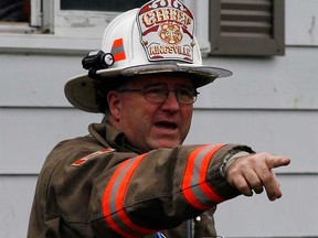 Kingsville Fire Chief Bob Kissner directs firefighters at the scene of a house fire in September 2011.