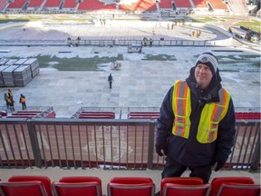 Mike Craig, NHL senior manager facility operations, is pictured in the stands as workers install the rink at Toronto BMO Field on Dec. 19, 2016. Preparations continue for the NHL Centennial Classic between Toronto Maple Leafs and Detroit Red Wings on Jan.1.