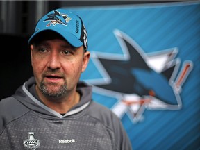 San Jose Sharks head coach Peter DeBoer talks with a reporter during Stanley Cup Finals media day in Pittsburgh on May 29, 2016.