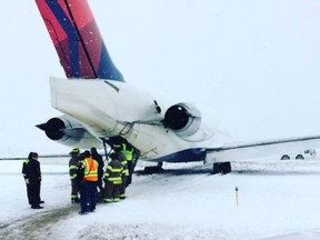 A plane that was attempting to land at Detroit Metro Airport slid off the runway and into the grass on Sunday morning, according to multiple reports.
