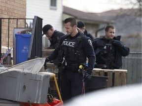 Windsor police officers conduct a search outside a residence at 1165 South Pacific Ave., on Dec. 9, 2016. One person is taken into custody.