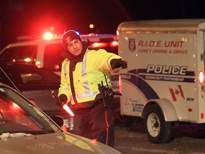 A LaSalle police officer talks to a motorist during a R.I.D.E. program in this 2012 file photo.