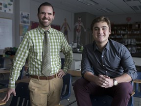Adam Mills, left, a physics teacher at Assumption College Catholic High School, visits with former student Adrian Di Meo, 18, now attending the University of Chicago. 
Di Meo nominated Mills for the university’s Outstanding Educator Award.