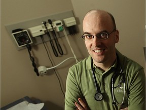 Dr. John Day is photographed in his Tecumseh office on April 15, 2011.