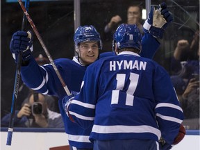 Maple Leafs center Auston Matthews (34) celebrates a goal with teammate Zach Hyman in Toronto on Tuesday Dec. 13, 2016.