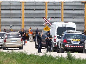 The scene of an accident involving a minivan and a freight train on Strong Road, north of County Road 42 in Lakeshore, is seen on June 10, 2012.