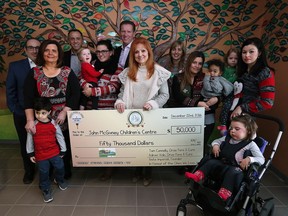 The John McGivney Centre is presented with a cheque for $50,000 during a news conference on Thursday, Dec. 22, 2016.