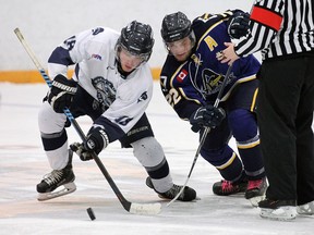 The Amherstburg Admirals Kasey Basile, who scored a goal on Wednesday,  battles for the puck with Eric Prudence of the Wheatley Sharks during a game earlier this season at the Libro Centre.