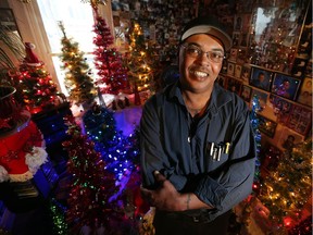 Herbie Harris is seen with his collection of Christmas trees at his home in Windsor on Dec. 8, 2016. Harris has collected 20 trees which he sets up every year.